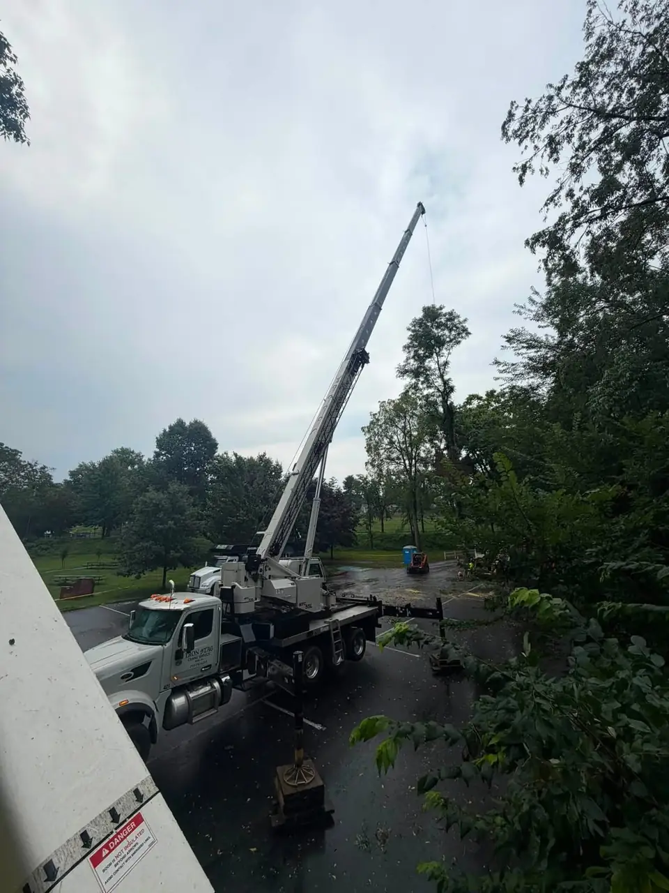 Billow's truck crane set up on the street with outriggers down